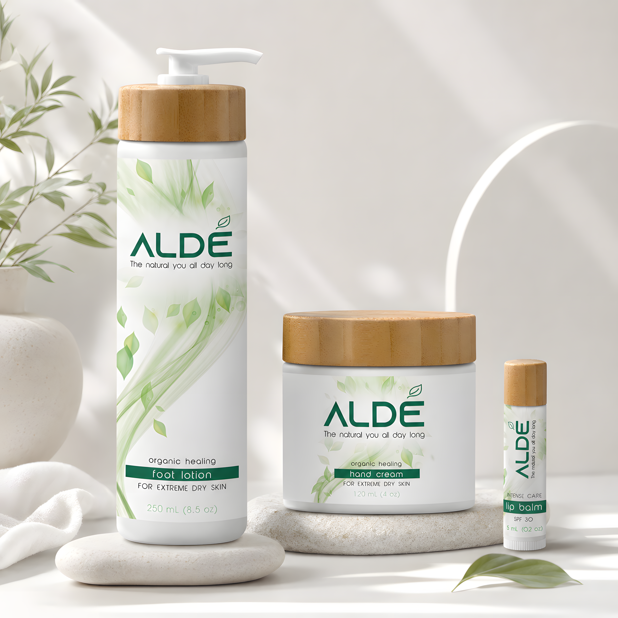 ALDE Naturals skincare packaging with lotion, cream, and lip balm containers
